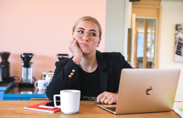 Professional woman looking bored in a meeting